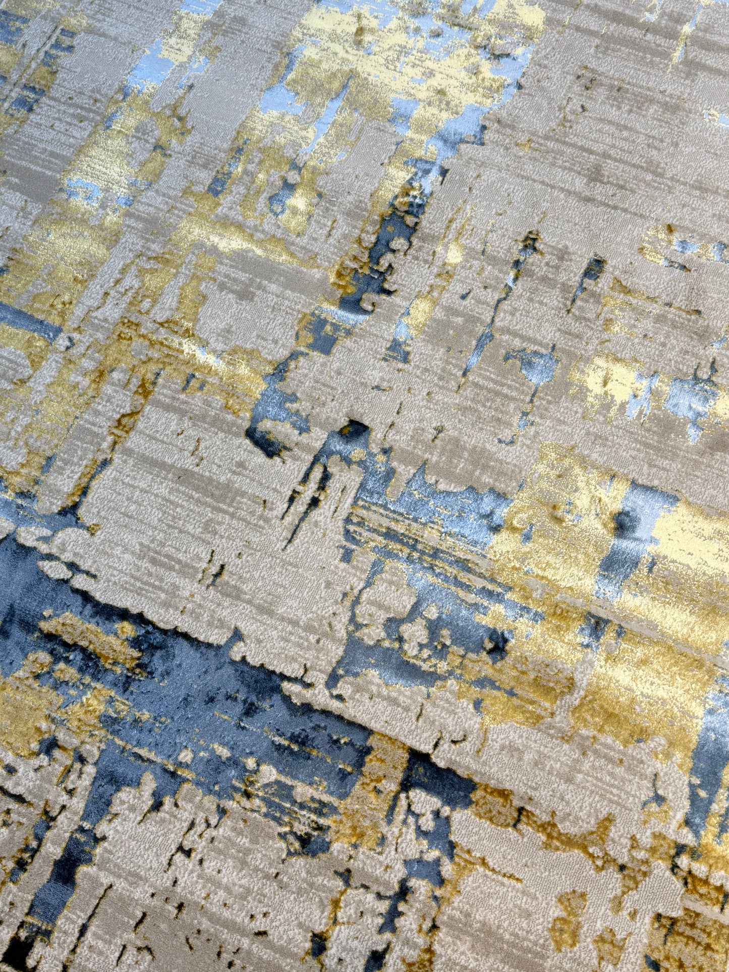The Modern Abstract Rug in shades of Grey, Beige , Blue and Gold is sized 150x220 cm (4.11 x 7.3 ft)