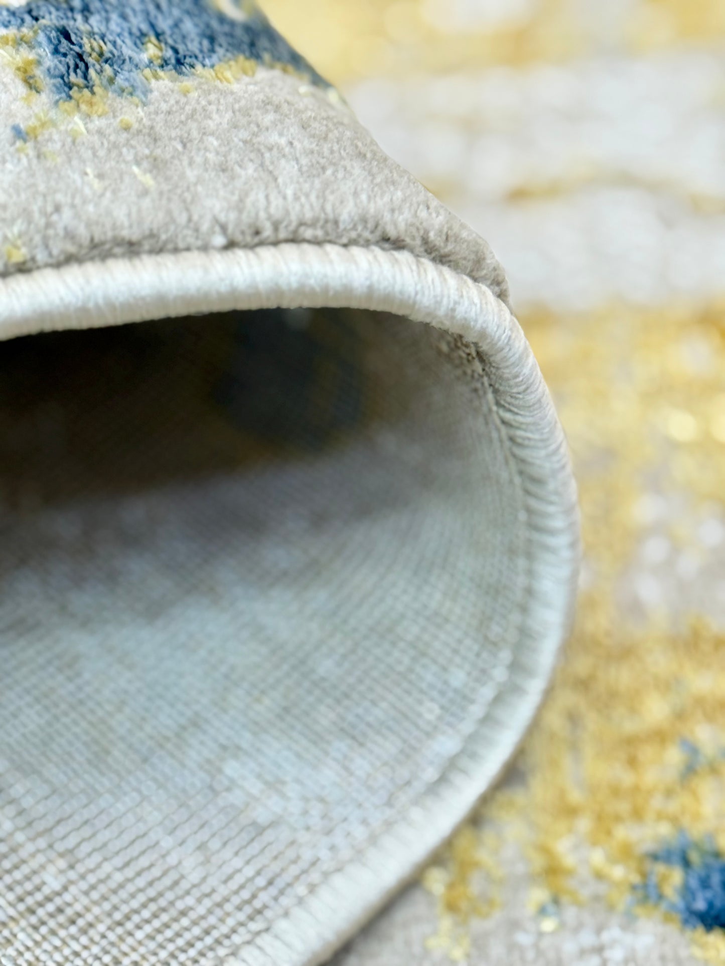 The Modern Abstract Rug in shades of Grey, Beige , Blue and Gold is sized 150x220 cm (4.11 x 7.3 ft)
