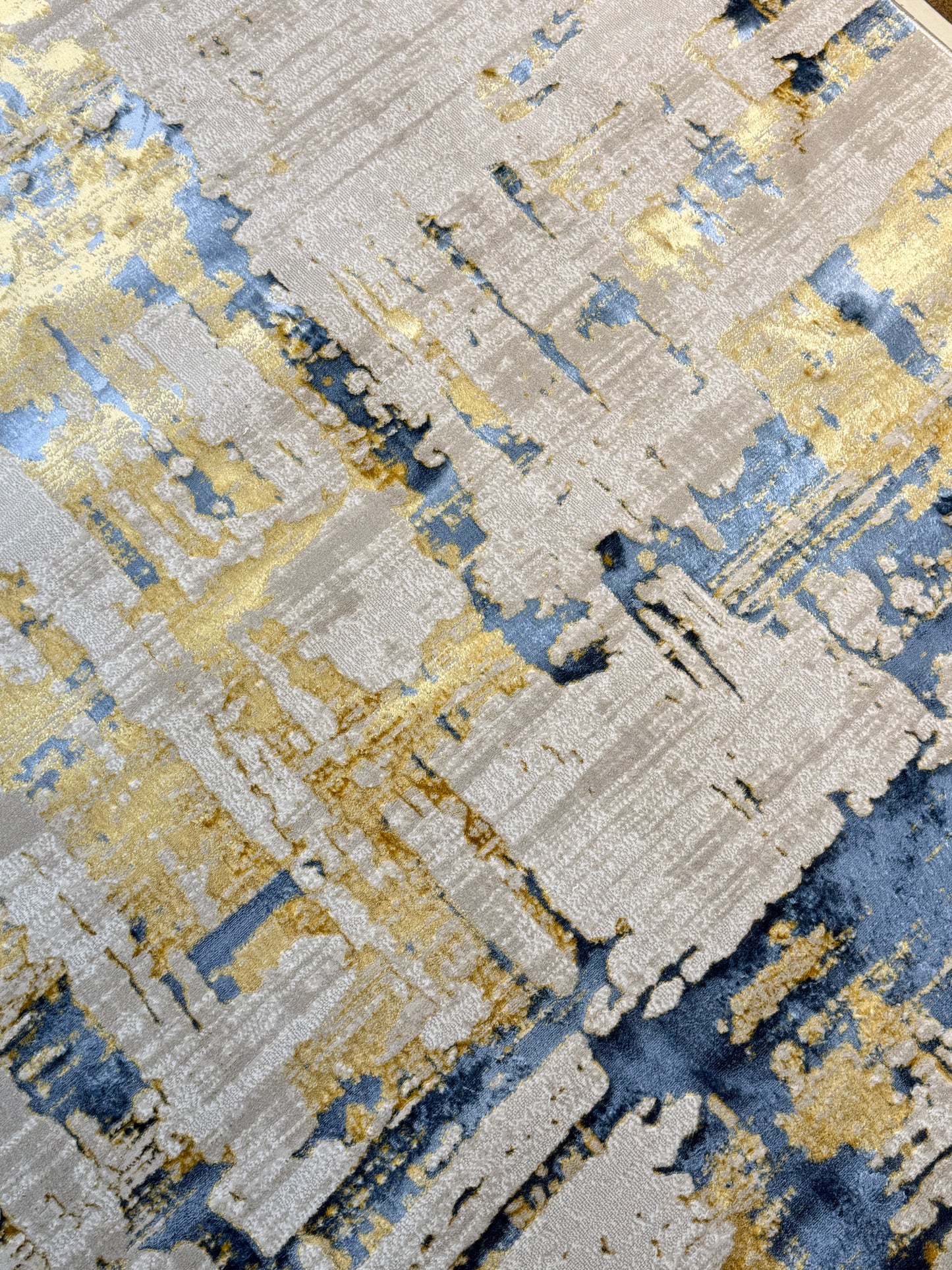 The Modern Abstract Rug in shades of Grey, Beige , Blue and Gold is sized 150x220 cm (4.11 x 7.3 ft)